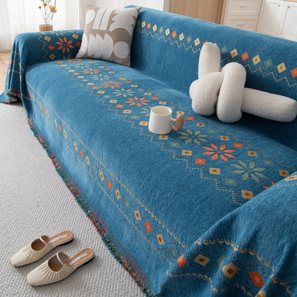 Housse réversible pour canapé bohème avec pompons – style chic et cosy